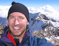 Rob on the summit with the south peak in the background