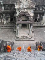Ascending monks at Angkor Wat