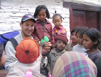 Making balloon animals for Nepali kids