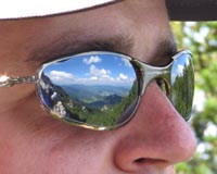 Mountains reflected in Tomas Izo's glasses